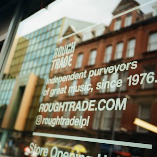 A Rough Trade store window with the social media reference.