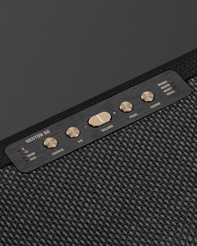 Close-up of the Marshall Heston 60 Black control panel with brass knobs and buttons for input, volume, bass, audio source, and sound mode - ideal for enhancing your soundbar setup.