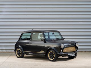 The outside of the Black Mini Remastered Marshall Edition with gold details.