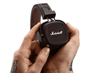 A hand showcasing a Marshall MAJOR IV headphone.