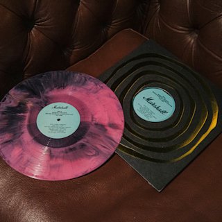 Pink and black vinyl on table)