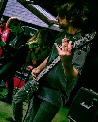 A band playing in a concert whilst using the Marshall Angled cabinet