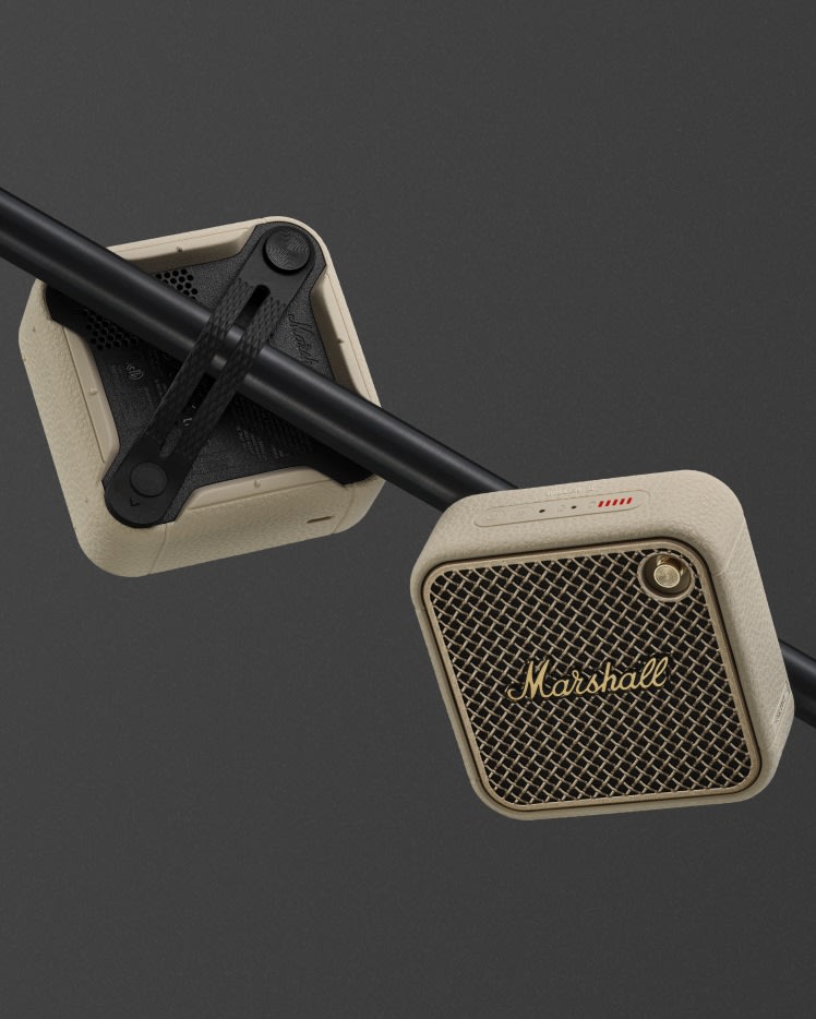 Two Marshall Willen II Cream speakers mounted on a horizontal black pole.