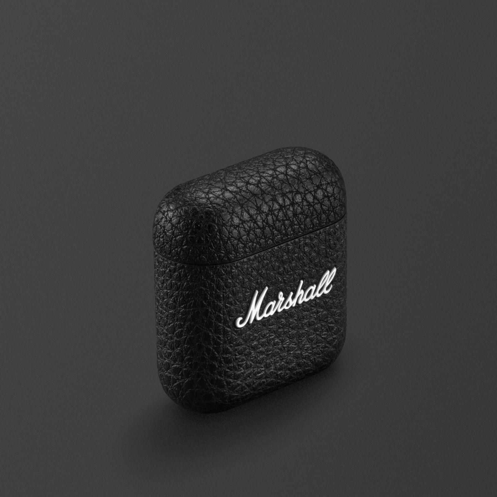 Marshall Minor IV Charging Case in Black, set against a dark background.