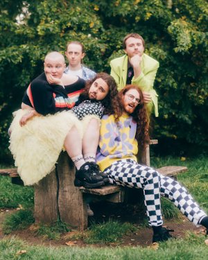 Gen and The Degenerates posing in a park