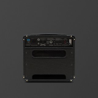 A black Marshall DSL1 guitar amplifier combo viewed from the back, showing input/output ports, control panel, power switch, and ventilation grill against a dark background.