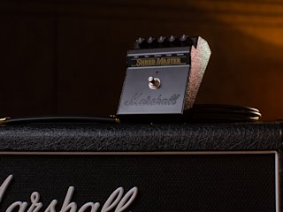 The Marshall Shredmaster Vintage Reissue Pedal placed on a Marshall amplifier.