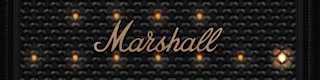 Close-up of the Marshall Bromley 750 party speaker’s black grille, featuring illuminated lights and Marshall logo at the center.