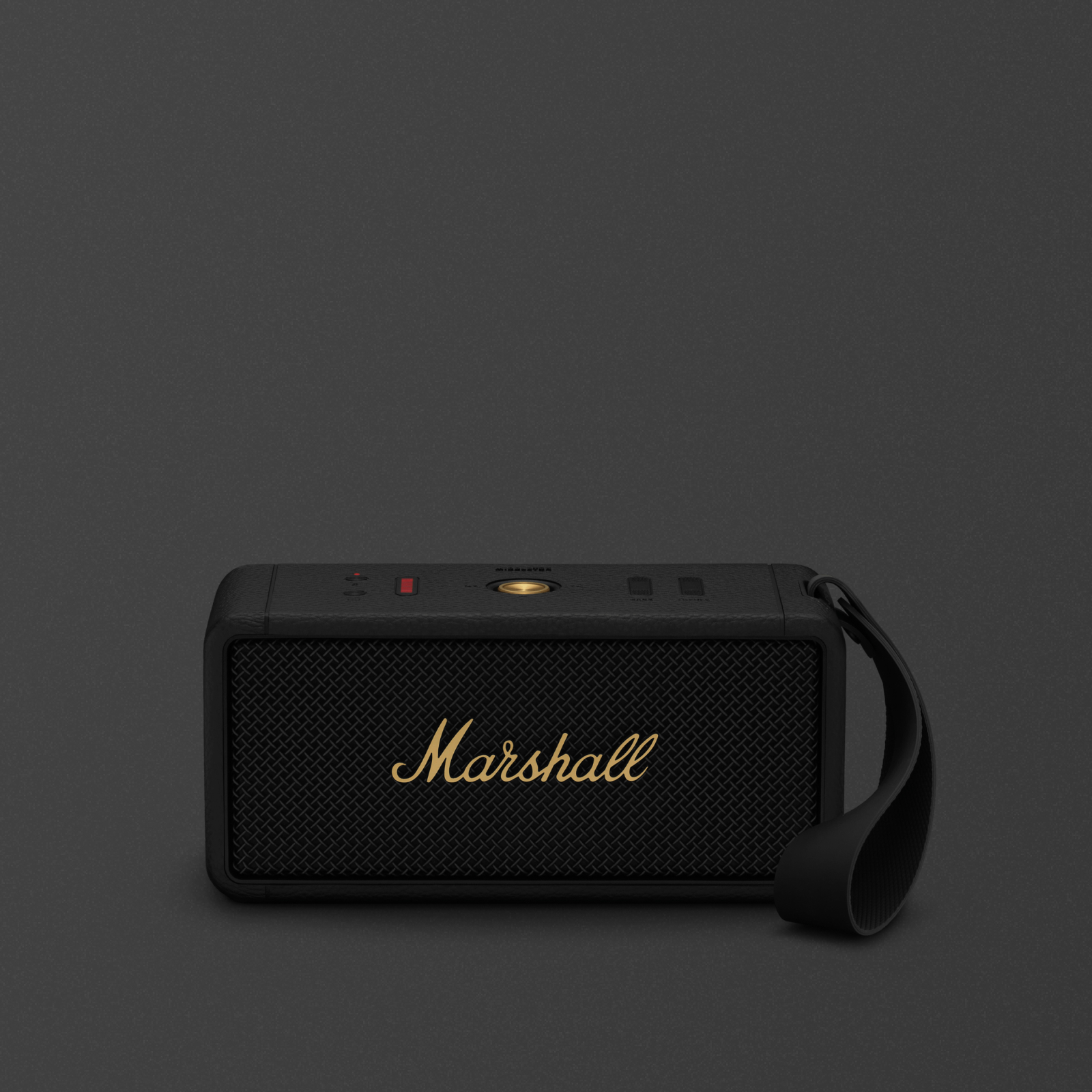 Tragbarer Middleton-Bluetooth-Lautsprecher auf dunklem Hintergrund.