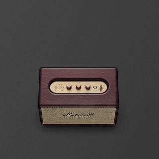 A burgundy Marshall Bluetooth speaker with brass control knobs is placed on a plain dark surface.
