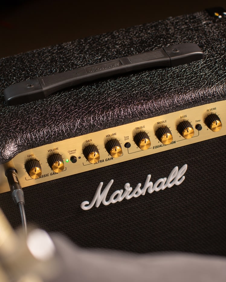Left side top view the Marshall DSL5 Combo showing knobs and logo.