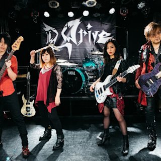 Chiiko by D Drive posing next to a turquoise Natal drum kit