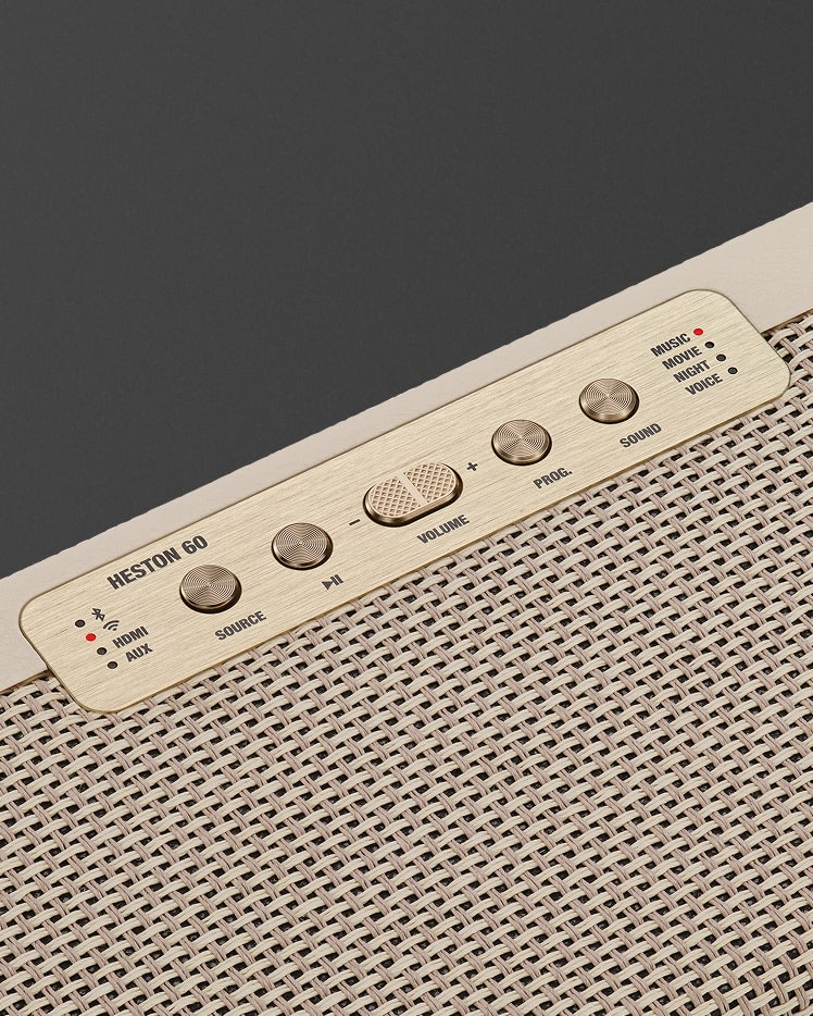 Close-up of the control panel on the Marshall Heston 60 Cream soundbar, showing beige and gold buttons and knobs labeled for volume, source, pairing, and sound modes.