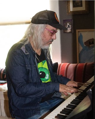 J Mascis plays piano.