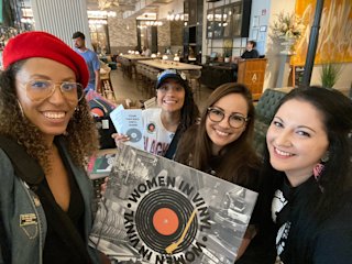 Happy people holding vinyls - Women in vinyl