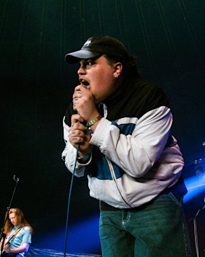 The 'Knives' singer in front of the stage whilst performing