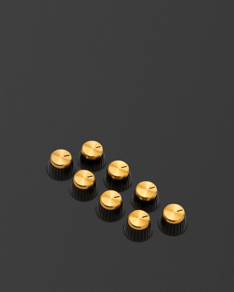 Botones con cuerpo marrón y tapa dorada.