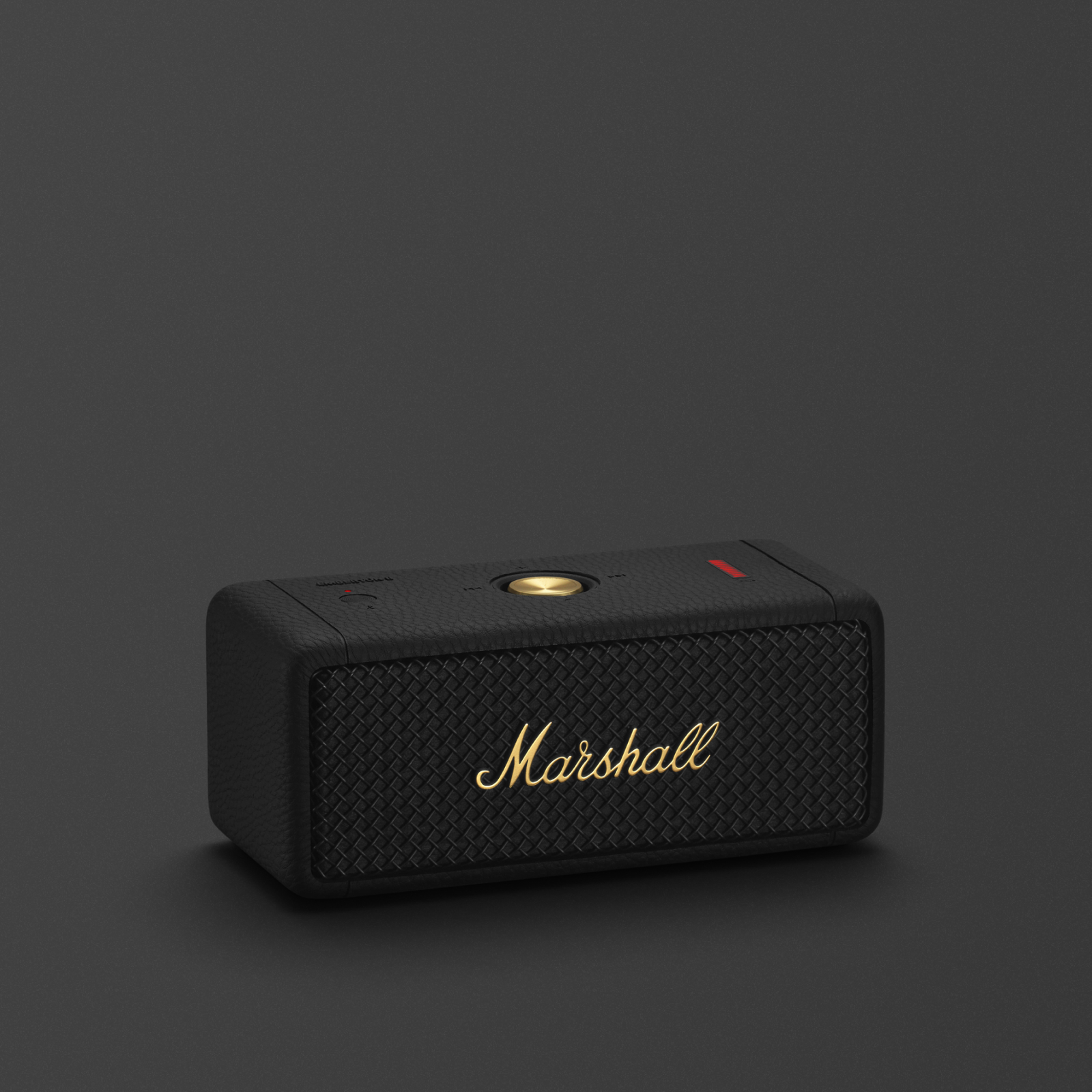 The Marshall EMBERTON II BLACK AND BRASS is a sleek black portable Bluetooth speaker.