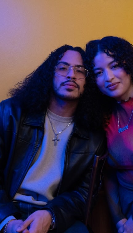 A couple posing for a picture.