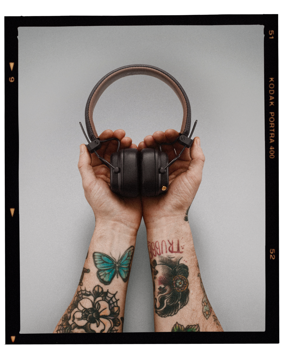 Marshall MAJOR IV headphones with tattoos on their hands.