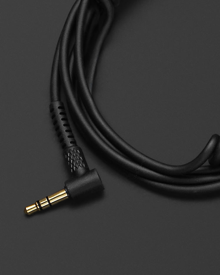 A Marshall headphone audio cable black with a gold connector on it.