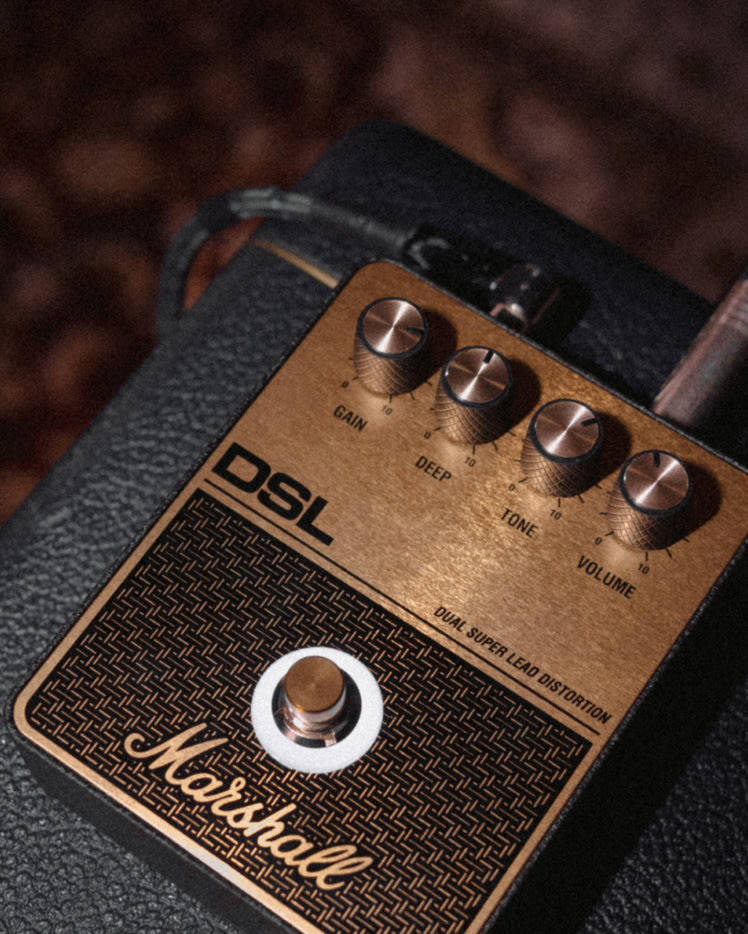 The Marshall DSL Overdrive pedal placed on top of a Amplifier.