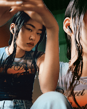 Woman with her Marshall Minor IV Black true wireless earbuds.