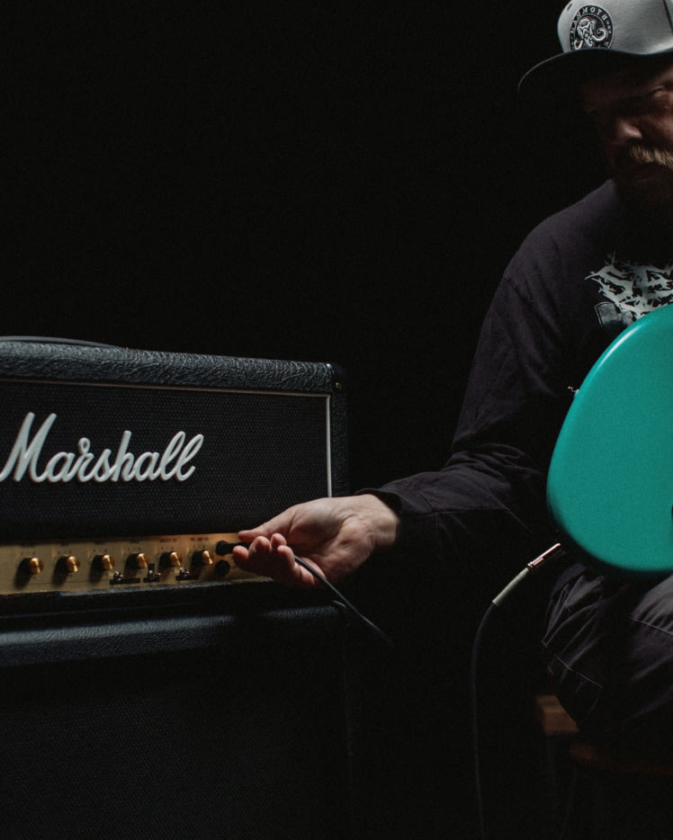 A musician adjusting JCM800 Modified