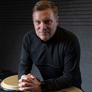Craig Blundell posing with the Natal drums percussion set