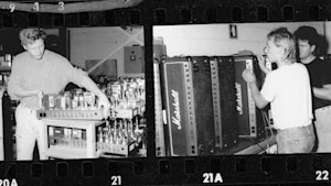 A black and white photo of a group of people in a Marshall JCM800 2203.