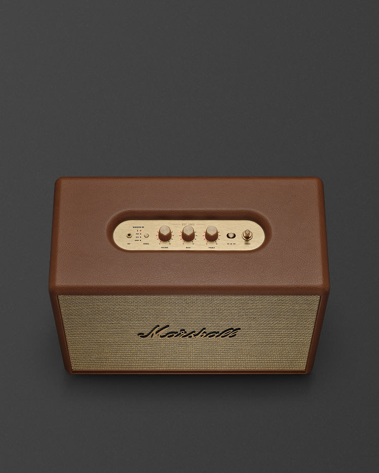 Top view of Marshall Woburn III Brown home speaker , featuring a brown leather-like casing, and a gold top panel with control knobs and buttons.
