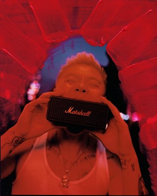 Bohan Phoenix holds Marshall Emberton III Black and Brass portable speaker.