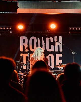 Band playing in a Rough trade stage