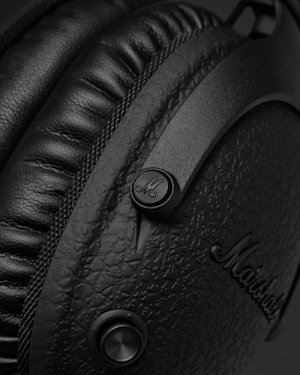 The M-button on a pair of Marshall Monitor II ANC Diamond Jubilee headphones.