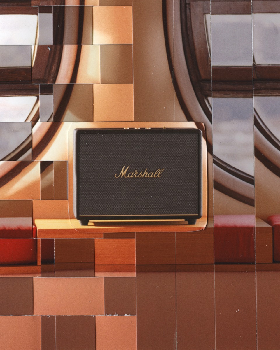 Marshall WOBURN III speaker placed by a window in the room.