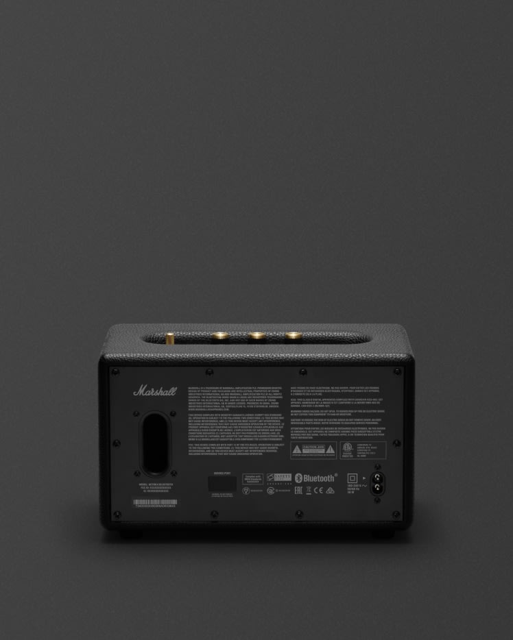 L'arrière d'une enceinte Marshall Acton II Bluetooth Black sur fond gris.