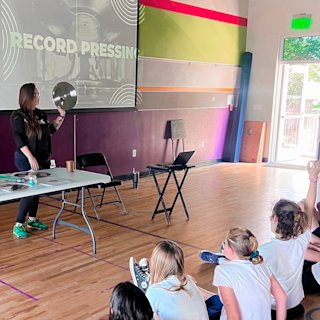 People in a group is raising hands