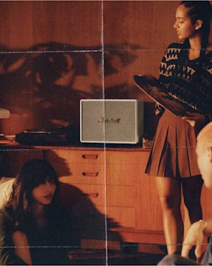 A group of people listening to music together in a living room