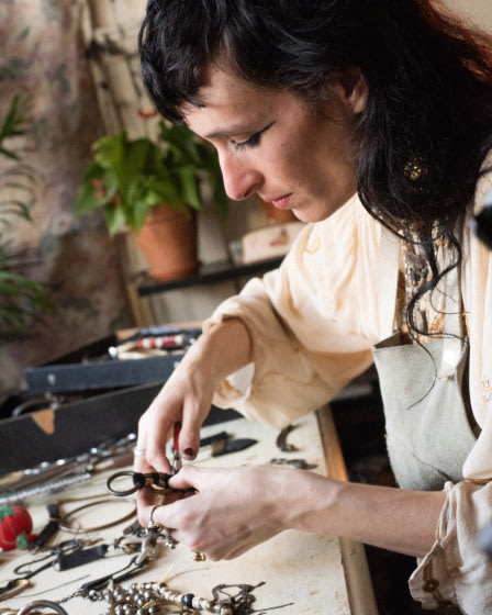 Zumi Rosow working on a piece of jewelry.