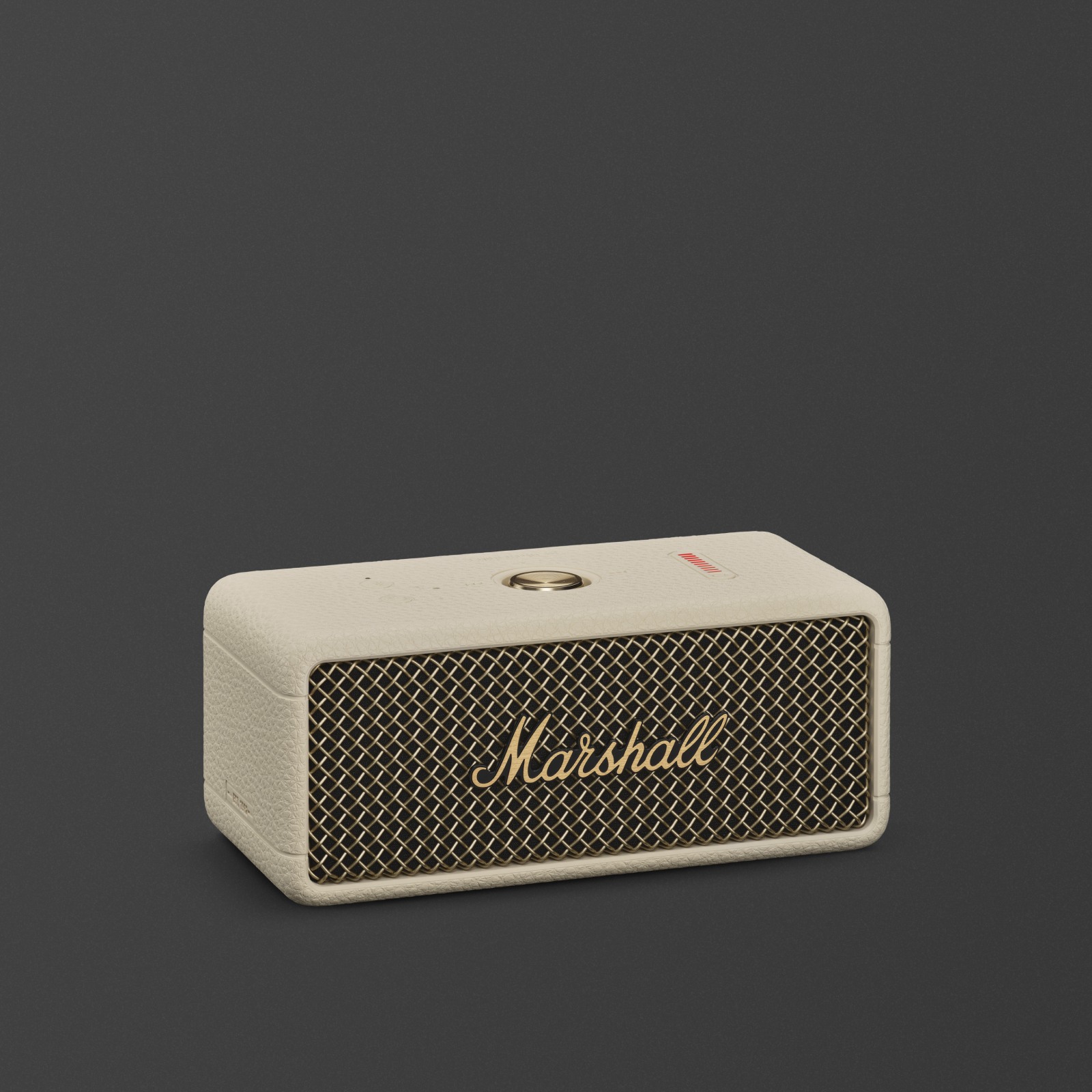 Marshall Emberton III Cream tragbarer Bluetooth-Lautsprecher vor einem dunklen Hintergrund.