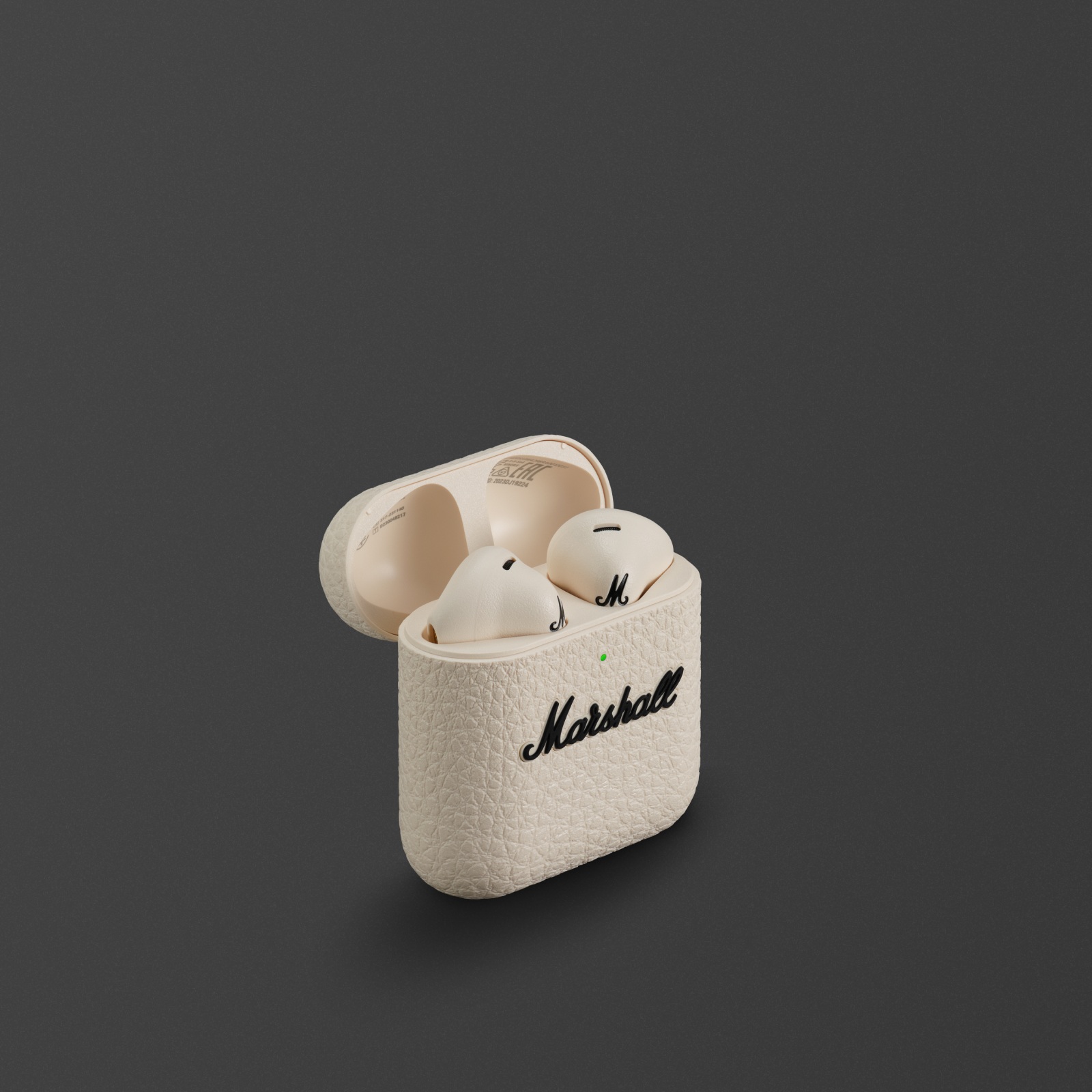 Un par de auriculares intrauditivos inalámbricos Minor IV Cream con estuche de carga a juego con el logotipo de Marshall.