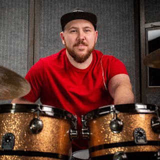 Jake Woodward posing with the Natal Snare Drums