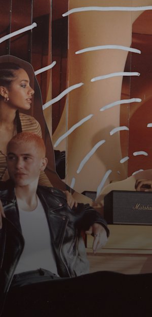 People sitting on a bench with Marshall speakers