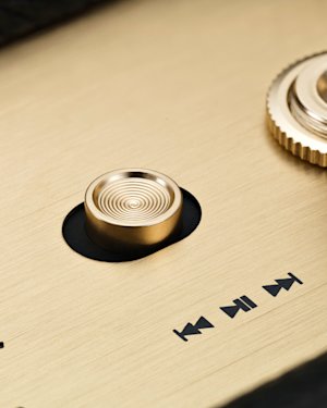 The media control button on top of a Marshall Stanmore III speaker.