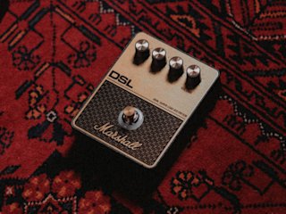 The Marshall DSL Overdrive pedal placed on top of a red rug.