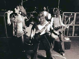 The whole band playing together on stage