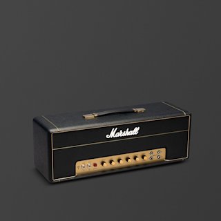 A black and brass Marshall 1987x Vintage Reissue guitar amplifier head with control knobs and switches is shown against a plain dark background.