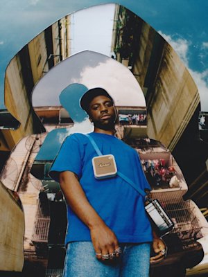 A collage showcasing Kelvin Krash holding a compact Marshall Willen II Cream bluetooth speaker.