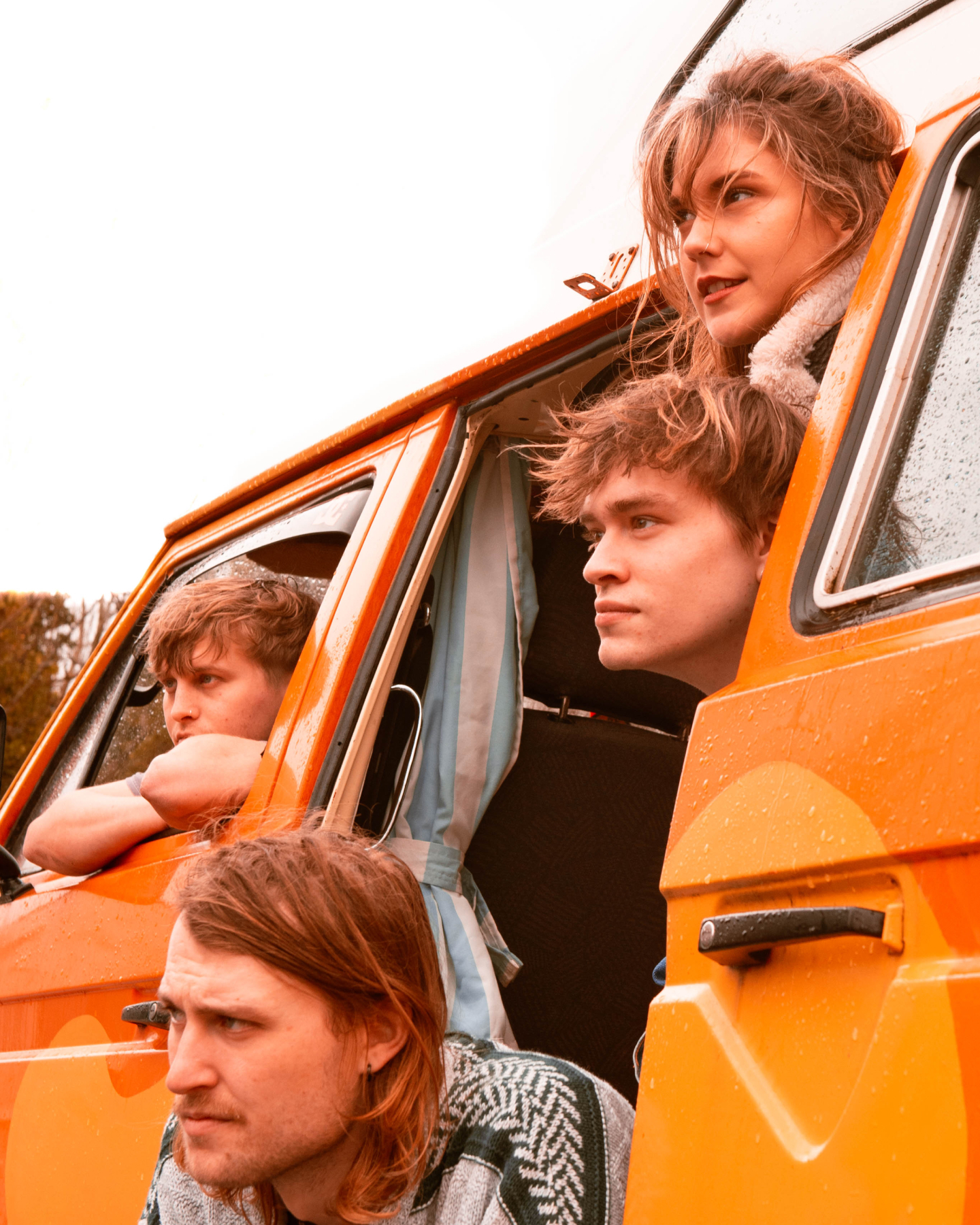 The band 'HUNNY BUZZ' looking out of a car.