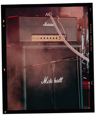 A photo of a Marshall 1959HW amp with smoke coming out of it.
